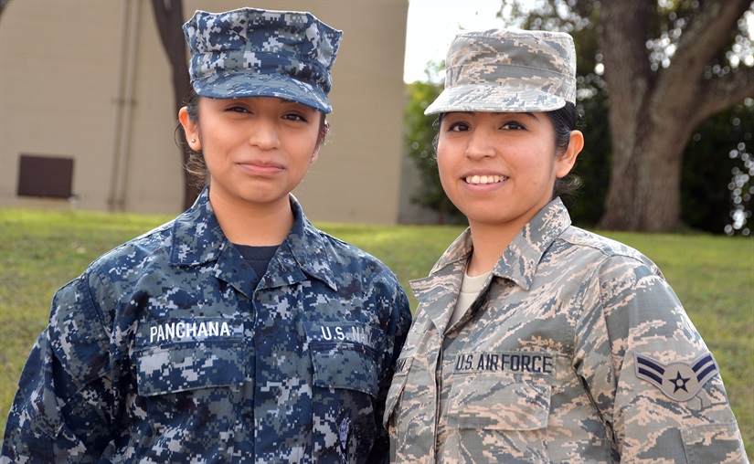 Sisters and service members, Navy Seaman Michelle Panchana, left, and Air Force Airman 1st Class Gisella Panchana are photographed as students together at the Medical Education and Training Campus at Joint Base San Antonio-Fort Sam Houston, Texas, Feb. 9, 2018. They attended school at the base from August 2017 to January 2018. Gisella graduated from the METC Radiology Program Jan. 30, while Michelle is scheduled to complete the METC Pharmacy Program in April. Photo by David DeKunder