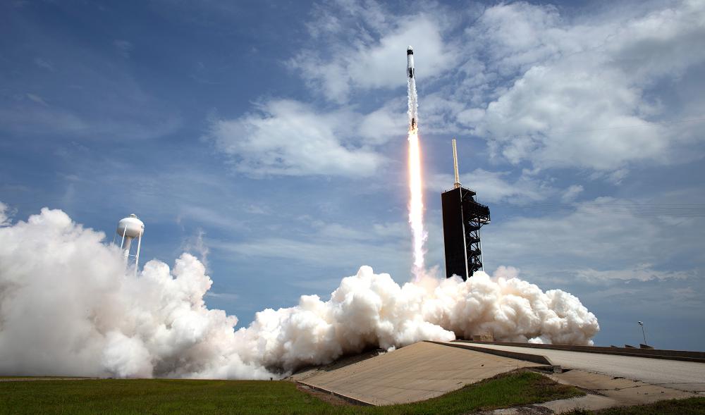 A SpaceX Falcon 9 rocket carrying NASA astronaut and retired Marine Corps Col. Douglas Hurley and fellow crew member Robert Behnken heads skyward during liftoff from Launch Complex 39A at NASA’s Kennedy Space Center, Florida, May 30, 2020. The mission marks the resumption of human space flight from the United States. Air National Guard members in Alaska and Hawaii provided support to the launch mission. (NASA photo by Joel Kowsky)