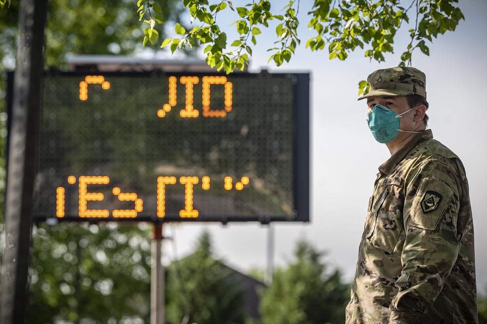 A West Virginia National Guard Soldier waits for local citizens to arrive to be tested for COVID-19 on May 22, 2020 in Charleston, W.Va. The WVNG's Chemical, Biological, Radiological, Nuclear and Explosive (CBRNE) Battalion, the 35th Civil Support Team (CST), and the 35th Enhanced Response Force Package (CERFP), which make up Task Force CRE, and Task Force Medical personnel are highly trained in operating in a "contaminated environment" and have conducted more than 3,000 tests for COVID-19 in 87 lane support missions since the beginning of our response 70 days ago. (U.S. Air National Guard Photo by Staff Sgt. Caleb Vance)