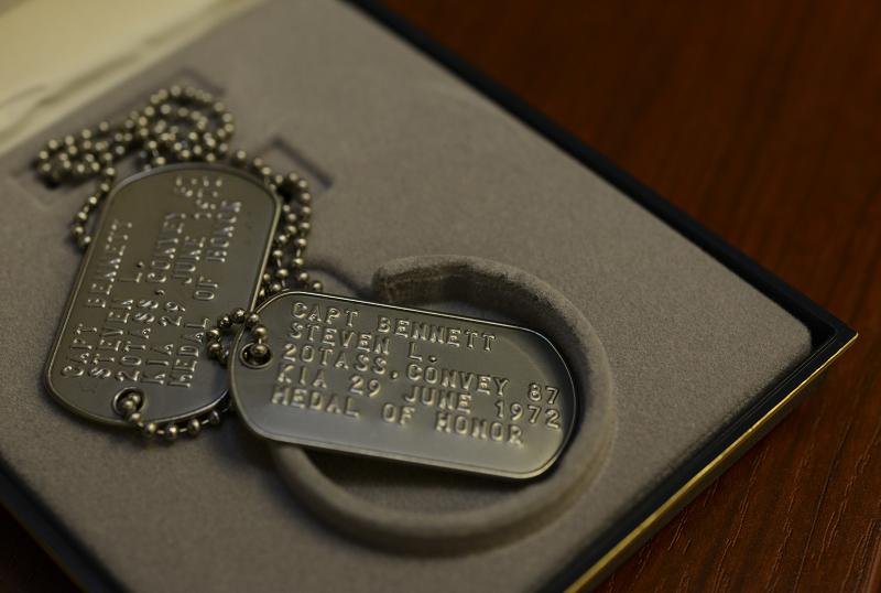 Replica dog tags for Medal of Honor recipient and OV-10 pilot Capt. Steven L. Bennett rest on a workstation at Hurlburt Field, Florida, Aug. 29, 2019. Bennett received the Medal of Honor for heroic actions performed while flying an artillery adjustment mission in Vietnam in June of 1972. Newly printed dog tags were presented to Bennett’s daughter, Angela Bennett-Engele after the original dog tags went missing. (U.S. Air Force photo by Staff Sgt. Lynette M. Rolen)