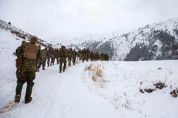U.S. Marines with the 26th Marine Expeditionary Unit (Special Operations Capable) (26MEU(SOC)) hike alongside Greek partners from the 32nd Marine Brigade, during cold weather training part of Greek Bilateral Exercise 2.0, Mount Olympus Mountain Training Center, Greece, Feb. 12, 2024. This bilateral training enabled the exchange of tactics, techniques, and procedures for both cold weather and mountain warfare environments, increasing interoperability between the two nations. The Bataan Amphibious Ready Group, with the embarked 26th MEU(SOC), is on a scheduled deployment in the U.S. Naval Forces Europe area of operations, employed by U.S. 6th Fleet to defend U.S., Allied, and partner interests. (U.S. Marine Corps photo by Sgt. Nayelly Nieves-Nieves)