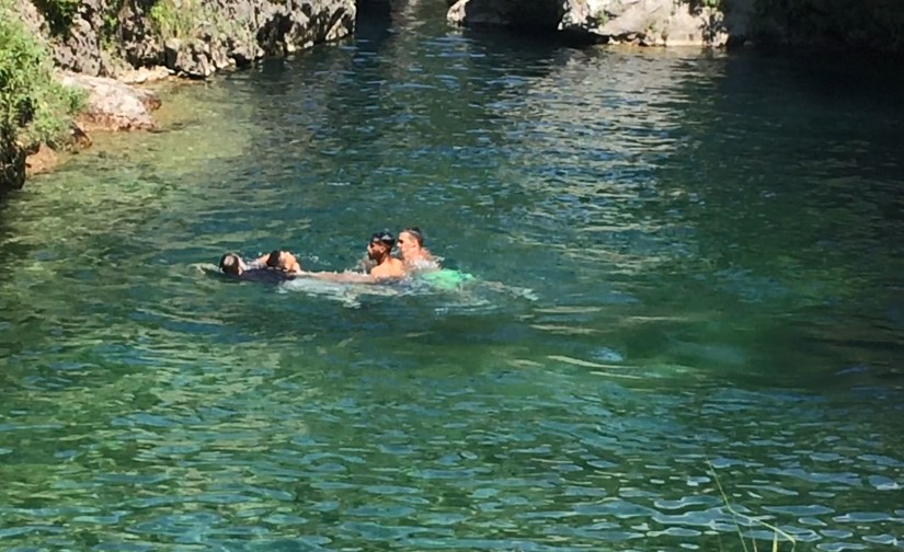 Army Lt. Col. John Hall, a public affairs officer for the 173rd Airborne Brigade Combat Team, saves a man from drowning in the frigid waters of Pria Park, a swimming hole in the Dolomite Mountains of northern Italy, June 17, 2018. The man was challenged to jump from the cliff that surrounds the deep swimming area formed by the melting snows from the surrounding mountains. Photo by Spc. Josselyn Fuentes