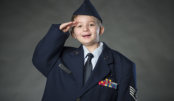 Elliot Banaszynski, son of Staff Sgt. Daniel Banaszynski, imitates his father as he salutes. U.S. Air Force photo by Staff Sgt. Vernon Young Jr.