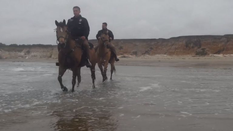 Air Force Staff Sgt. Zechariah Landa and Senior Airman Michael Terrazas trot along the beach on the unit’s working horses.