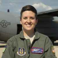 Air Force Reserve Staff Sgt. Annie Lepillez poses for a photo in front of a C-130J Super Hercules. Photo By: DOD photo
